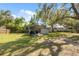 Wide backyard with covered parking and storage at 12430 Oconee Blvd, New Port Richey, FL 34654