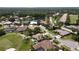 Gorgeous aerial of a golf course community featuring lush greenery, serene ponds, and well-manicured lawns at 1311 Fallsmeade Ct, Oldsmar, FL 34677