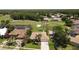 Aerial view of a single-story home overlooking a golf course, surrounded by lush landscaping at 1311 Fallsmeade Ct, Oldsmar, FL 34677