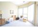 Bright bedroom with comfortable seating, ample natural light, and neutral colors, creating a relaxing and inviting atmosphere at 1311 Fallsmeade Ct, Oldsmar, FL 34677