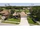 Attractive single-story home on a golf course, boasting a well-kept lawn and a three-car garage at 1311 Fallsmeade Ct, Oldsmar, FL 34677