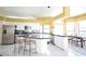Spacious kitchen with white cabinetry, stainless steel appliances, and granite countertops at 1311 Fallsmeade Ct, Oldsmar, FL 34677