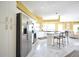 Open kitchen with stainless steel appliances and an island with seating at 1311 Fallsmeade Ct, Oldsmar, FL 34677