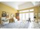 Elegant living room featuring a vaulted ceiling and neutral walls at 1311 Fallsmeade Ct, Oldsmar, FL 34677
