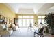 Bright living room with high ceilings, furniture and an area rug at 1311 Fallsmeade Ct, Oldsmar, FL 34677