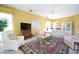 Spacious living room with comfortable seating, a large television, and ample natural light from large windows at 1311 Fallsmeade Ct, Oldsmar, FL 34677