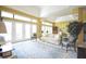 Bright living room with large windows, neutral tones, and elegant furnishings at 1311 Fallsmeade Ct, Oldsmar, FL 34677