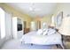 Comfortable main bedroom with plush bedding, dresser, and natural light, creating a relaxing and inviting space at 1311 Fallsmeade Ct, Oldsmar, FL 34677