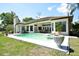 Inviting pool and spa, surrounded by lush landscaping and an outdoor seating area for relaxation and enjoyment at 1311 Fallsmeade Ct, Oldsmar, FL 34677