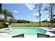 Backyard features a beautiful swimming pool overlooking the golf course at 1311 Fallsmeade Ct, Oldsmar, FL 34677
