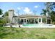 Enjoy this beautiful backyard pool, patio, and landscaped yard perfect for outdoor gatherings at 1311 Fallsmeade Ct, Oldsmar, FL 34677