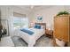 Well-lit bedroom with a large window, cozy bedding, and stylish furnishings, enhancing the room's warmth at 1325 Snell Isle Ne Blvd # 607, St Petersburg, FL 33704