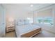 Bright bedroom with neutral tones, and a large window offering a charming neighborhood view at 1325 Snell Isle Ne Blvd # 607, St Petersburg, FL 33704