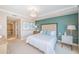 Serene bedroom with a king bed, turquoise accent wall, and refined decor at 1325 Snell Isle Ne Blvd # 607, St Petersburg, FL 33704