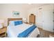 Bedroom featuring light walls and floors, a bed with cozy bedding, and stylish furnishings, creating a warm space at 1325 Snell Isle Ne Blvd # 607, St Petersburg, FL 33704