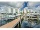 Boat docks with many boats sitting atop the water with two tall condo buildings in the background at 1325 Snell Isle Ne Blvd # 607, St Petersburg, FL 33704