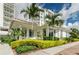 Exterior view of a stylish building with palm trees and manicured landscaping at 1325 Snell Isle Ne Blvd # 607, St Petersburg, FL 33704