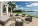An outdoor fire pit area with comfortable seating and lush landscaping offers a great view of the water at 1325 Snell Isle Ne Blvd # 607, St Petersburg, FL 33704