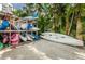 Kayak storage rack for community residents, surrounded by lush tropical palm trees at 1325 Snell Isle Ne Blvd # 607, St Petersburg, FL 33704