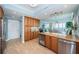 Well-equipped kitchen with stainless steel appliances, wooden cabinetry, and a convenient wine cooler at 1325 Snell Isle Ne Blvd # 607, St Petersburg, FL 33704