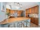 Kitchen with a center island and breakfast bar with stainless steel appliances, and mosaic backsplash at 1325 Snell Isle Ne Blvd # 607, St Petersburg, FL 33704