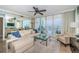 Bright living room featuring comfortable seating, balcony access, and stunning views of the Gulf at 1325 Snell Isle Ne Blvd # 607, St Petersburg, FL 33704