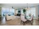 Open concept living space with water views, a dining area, and light tile flooring for an airy feel at 1325 Snell Isle Ne Blvd # 607, St Petersburg, FL 33704