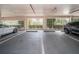 Well-lit parking garage featuring assigned parking spots and a view of green landscaping at 1325 Snell Isle Ne Blvd # 607, St Petersburg, FL 33704