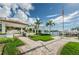 Beautiful landscaped patio and walkway leading to the marina, with picturesque water views at 1325 Snell Isle Ne Blvd # 607, St Petersburg, FL 33704