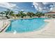 Community pool surrounded by tropical landscaping and lounge chairs at 1325 Snell Isle Ne Blvd # 607, St Petersburg, FL 33704