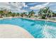 A beautiful outdoor swimming pool surrounded by lush landscaping and lounge chairs with sparkling water features at 1325 Snell Isle Ne Blvd # 607, St Petersburg, FL 33704