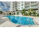 Stunning swimming pool with clear blue water, poolside seating, and views of the building at 1325 Snell Isle Ne Blvd # 607, St Petersburg, FL 33704