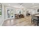 Bright living room with wood floors, a desk, and French doors to outdoor living space at 1391 50Th Ne Ave, St Petersburg, FL 33703