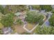 Aerial view of neighborhood playground with mature landscaping and shade, providing a recreational space for families at 1418 Rushgrove Cir, Dover, FL 33527