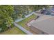 Aerial view of a private, fenced backyard with lush lawn and patio area for outdoor entertaining at 1418 Rushgrove Cir, Dover, FL 33527