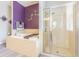 A bathroom featuring a soaking tub, separate shower, and decorative tile at 1418 Rushgrove Cir, Dover, FL 33527