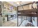 Bedroom boasts bunk bed with shelves, a modern rug, and a closet at 1418 Rushgrove Cir, Dover, FL 33527