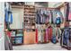 A walk-in closet with ample storage space for clothing and shoes at 1418 Rushgrove Cir, Dover, FL 33527