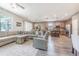 Open living area combines kitchen, dining, and living spaces, perfect for modern living at 1418 Rushgrove Cir, Dover, FL 33527