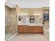 Bathroom featuring shower, double sinks, soaking tub, and recessed wall art at 15254 Bellamy Rd, Tampa, FL 33625