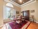 Elegant dining room with hardwood floors, natural light, and traditional furnishings at 15254 Bellamy Rd, Tampa, FL 33625