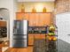 Kitchen with stainless steel refrigerator and fruit display at 15254 Bellamy Rd, Tampa, FL 33625