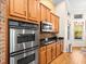 Stainless steel oven, gas cooktop, and wood cabinets at 15254 Bellamy Rd, Tampa, FL 33625