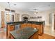 Kitchen island with black granite countertops at 15254 Bellamy Rd, Tampa, FL 33625