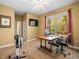 Bright office with a large window overlooking the trees and a ceiling fan at 15254 Bellamy Rd, Tampa, FL 33625