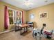 Sunlit office space with large window and gym equipment at 15254 Bellamy Rd, Tampa, FL 33625