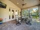Covered patio featuring outdoor seating with a view of the back yard at 15254 Bellamy Rd, Tampa, FL 33625