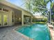 Screened pool with water feature, adjacent to the covered patio at 15254 Bellamy Rd, Tampa, FL 33625