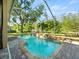 Refreshing screened-in pool area with brick pavers, privacy and serene outdoor space at 15254 Bellamy Rd, Tampa, FL 33625