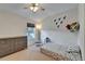 Bright ' bedroom with vaulted ceiling, window, dresser and whimsical decor at 15825 Fishhawk View Dr, Lithia, FL 33547